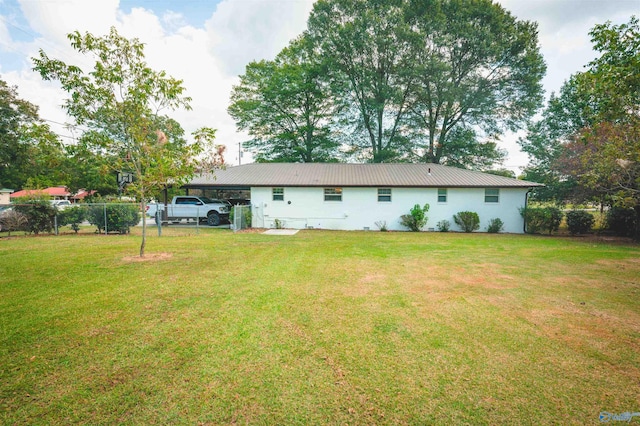 rear view of house with a lawn