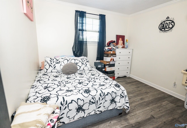 bedroom with ornamental molding and dark hardwood / wood-style flooring