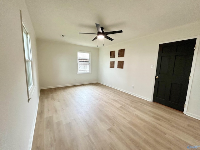 2704 Mctavish Ave SW, Decatur, AL 35603 - spare room featuring light wood finished floors, ceiling fan, and baseboards