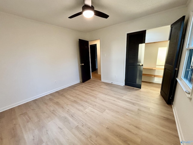 2704 Mctavish Ave SW, Decatur, AL 35603 - unfurnished bedroom with light wood-style floors, baseboards, ceiling fan, and ornamental molding