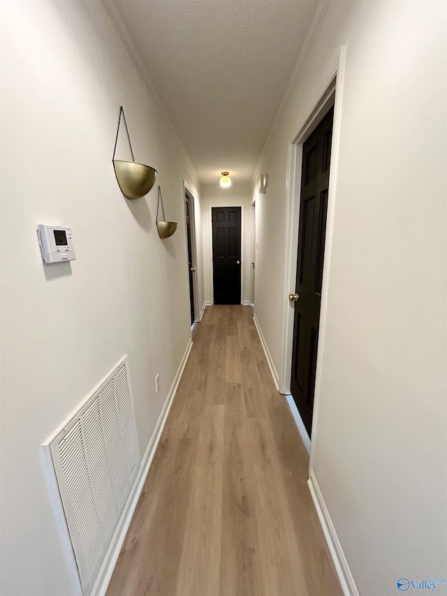 2704 Mctavish Ave SW, Decatur, AL 35603 - hallway featuring light wood-style floors and baseboards
