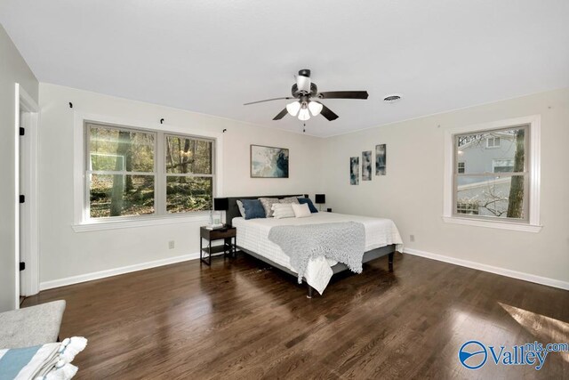 bedroom featuring dark wood-type flooring and ceiling fan