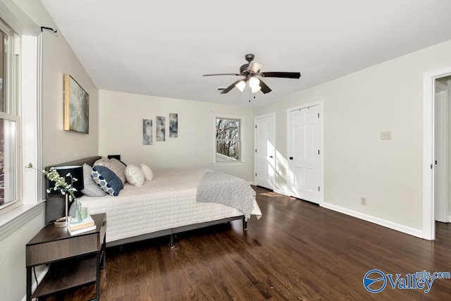 bedroom with dark wood-type flooring and ceiling fan