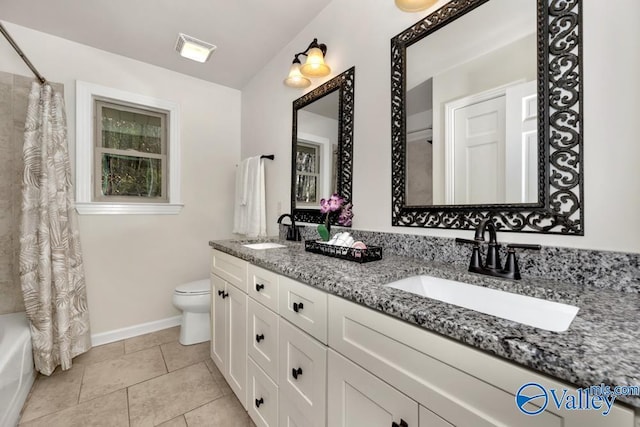 full bathroom with tile patterned flooring, vanity, shower / tub combo, and toilet