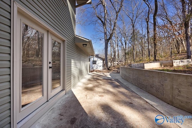 view of property exterior with a patio