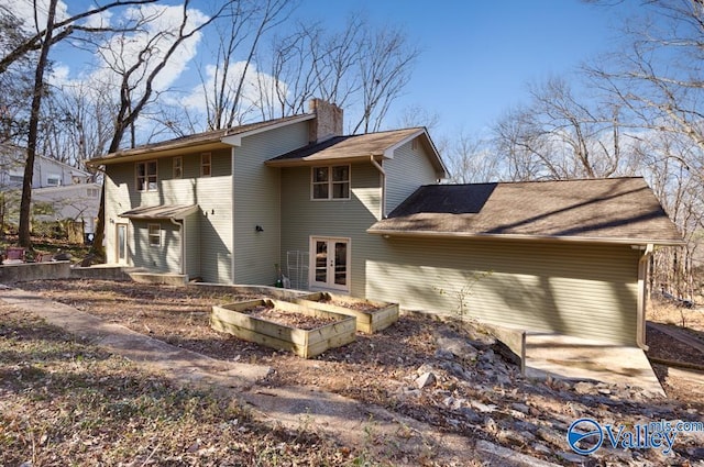 back of house featuring french doors