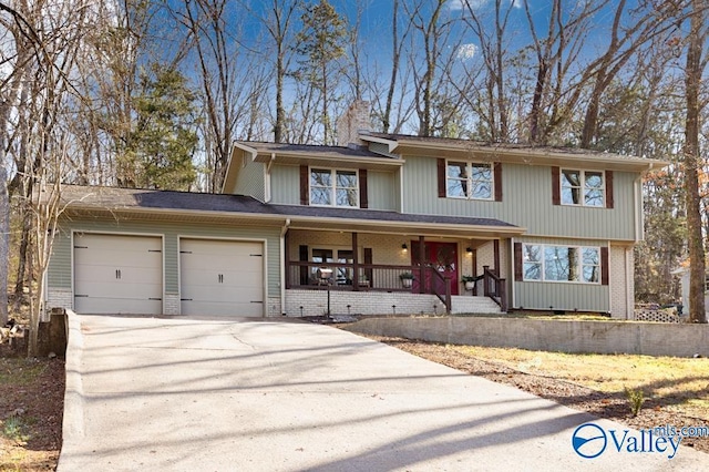 view of front of house with a garage and covered porch