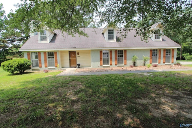 233 Shaw Rd NW, Hartselle, AL 35640 - new england style home featuring a front lawn