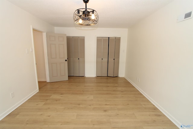 233 Shaw Rd NW, Hartselle, AL 35640 - unfurnished dining area featuring light wood-style flooring and baseboards
