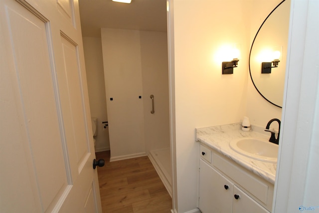 233 Shaw Rd NW, Hartselle, AL 35640 - bathroom with wood finished floors and vanity