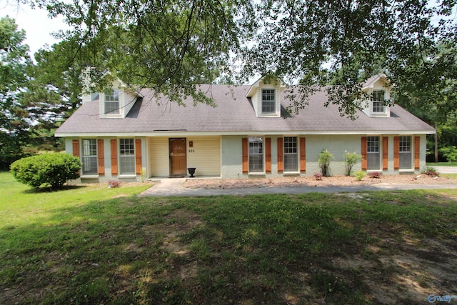 233 Shaw Rd NW, Hartselle, AL 35640 - cape cod house with a front yard and roof with shingles
