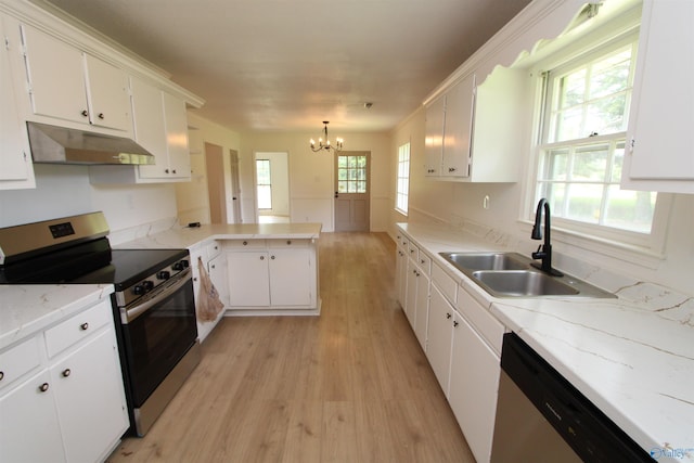 233 Shaw Rd NW, Hartselle, AL 35640 - kitchen with appliances with stainless steel finishes, under cabinet range hood, a sink, light wood-style floors, and a chandelier