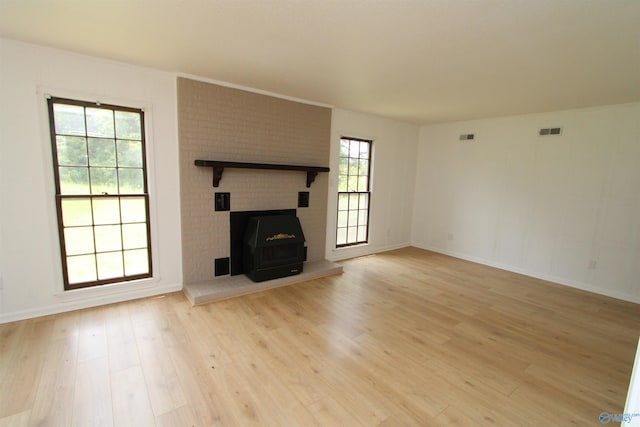 233 Shaw Rd NW, Hartselle, AL 35640 - unfurnished living room with light wood-style floors and baseboards