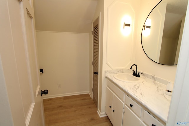 233 Shaw Rd NW, Hartselle, AL 35640 - bathroom featuring vanity and wood finished floors