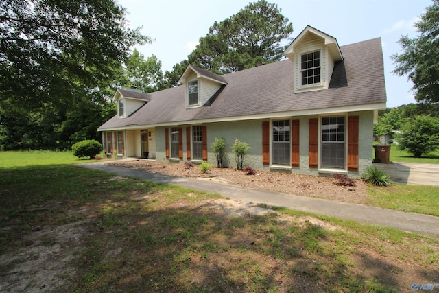 233 Shaw Rd NW, Hartselle, AL 35640 - cape cod home featuring a front yard and a shingled roof