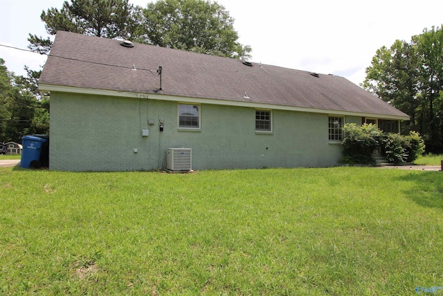 233 Shaw Rd NW, Hartselle, AL 35640 - rear view of property with cooling unit, a shingled roof, a yard, and brick siding