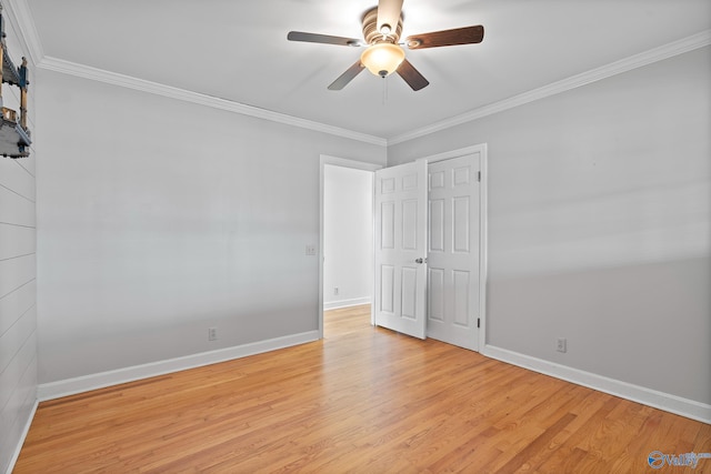 spare room with ornamental molding, ceiling fan, and light hardwood / wood-style floors