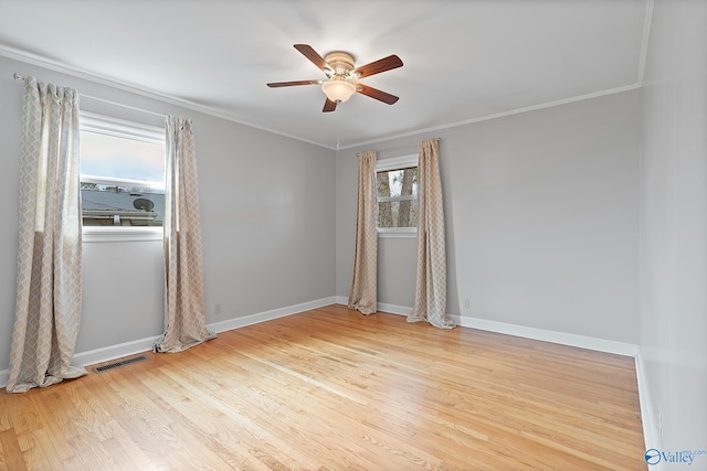 unfurnished room featuring ornamental molding, ceiling fan, and light wood-type flooring