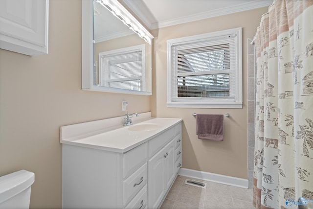 bathroom featuring toilet, vanity, walk in shower, crown molding, and tile patterned floors