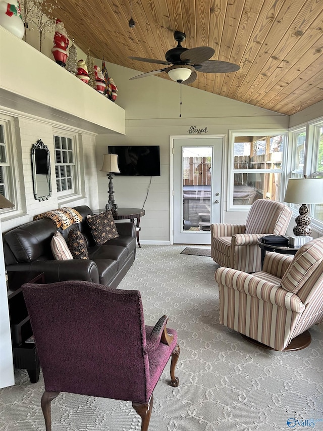 carpeted living room featuring lofted ceiling, wooden ceiling, and ceiling fan