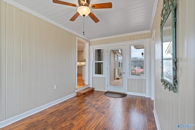 unfurnished sunroom featuring ceiling fan