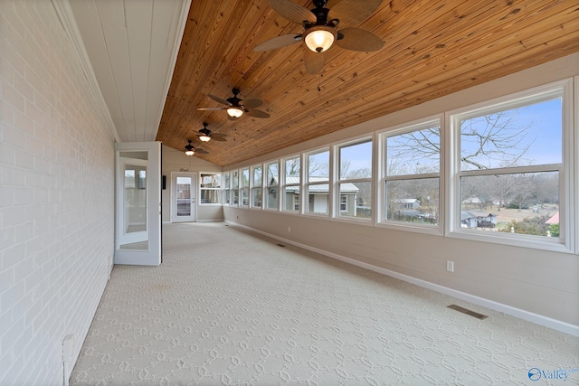 unfurnished sunroom with lofted ceiling and wood ceiling