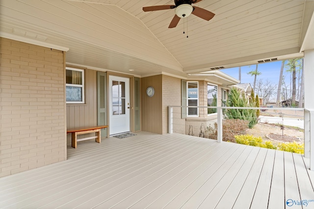 wooden terrace featuring ceiling fan