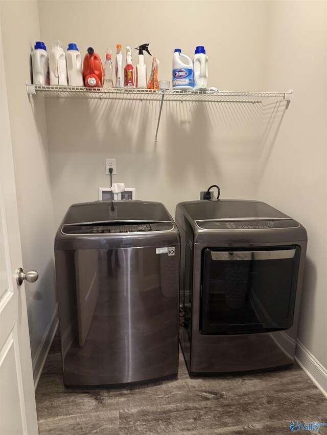 115 Richard Rd NE, Huntsville, AL 35811 - clothes washing area with baseboards, washer and dryer, wood finished floors, and laundry area