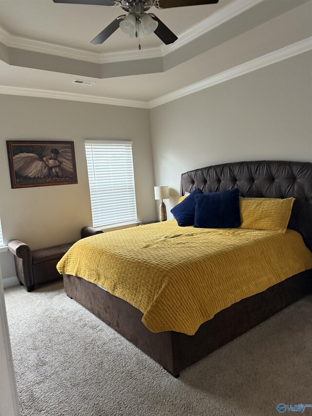 115 Richard Rd NE, Huntsville, AL 35811 - carpeted bedroom with a ceiling fan, visible vents, crown molding, and a raised ceiling