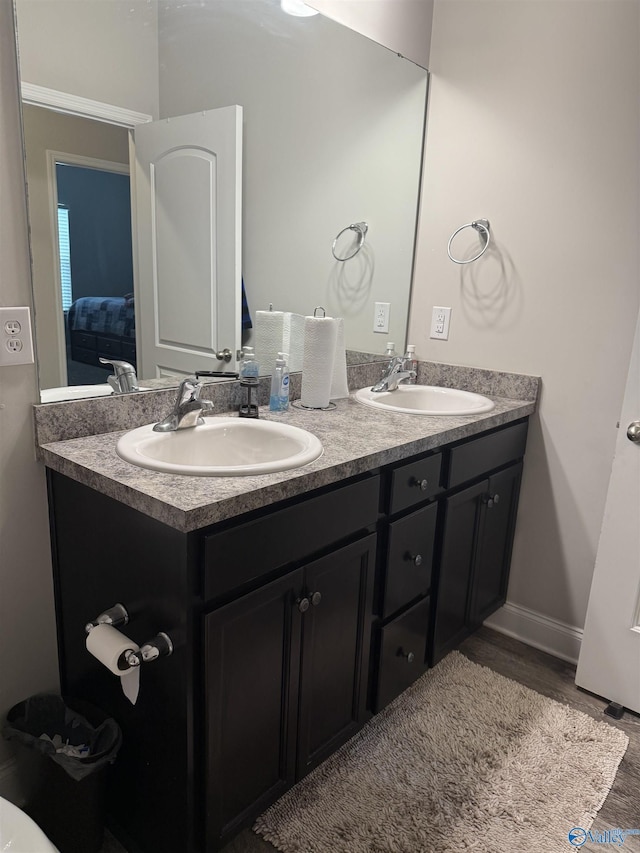 115 Richard Rd NE, Huntsville, AL 35811 - full bath featuring double vanity, a sink, baseboards, and wood finished floors