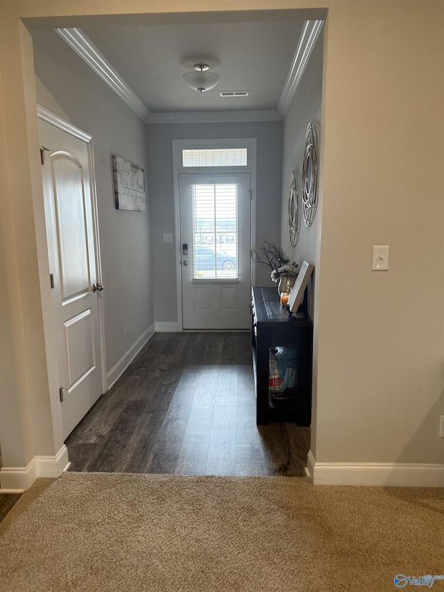 115 Richard Rd NE, Huntsville, AL 35811 - foyer entrance with baseboards, visible vents, ornamental molding, and dark wood-style floors