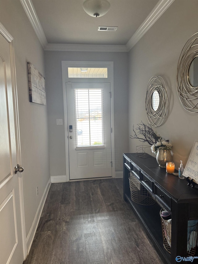 115 Richard Rd NE, Huntsville, AL 35811 - doorway with baseboards, visible vents, ornamental molding, and dark wood-style flooring