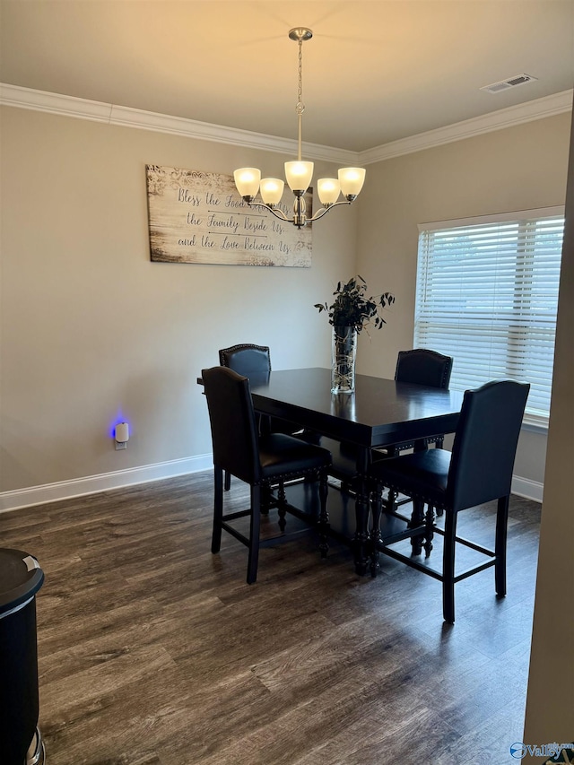 115 Richard Rd NE, Huntsville, AL 35811 - dining area featuring dark wood-type flooring, crown molding, visible vents, and a notable chandelier