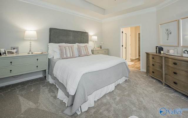 bedroom with crown molding, light carpet, and a raised ceiling