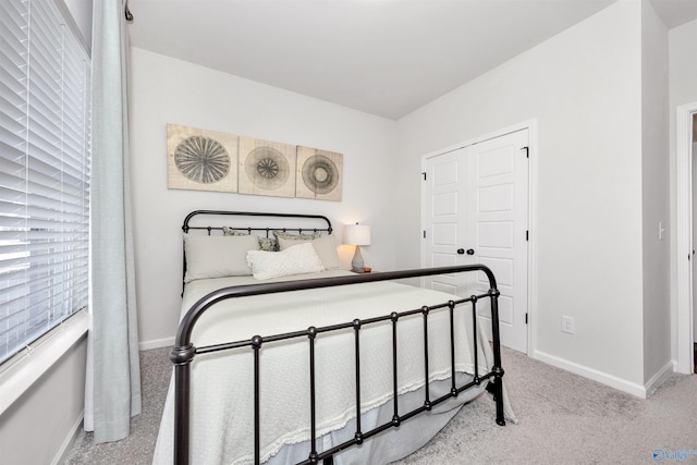 bedroom featuring light carpet