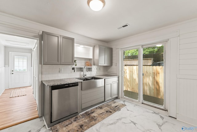 412 Oshaughnessy Ave NE, Huntsville, AL 35801 - kitchen with gray cabinets, dishwasher, a sink, tasteful backsplash, and light stone counters