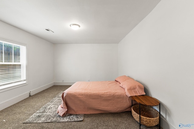 412 Oshaughnessy Ave NE, Huntsville, AL 35801 - carpeted bedroom featuring baseboards