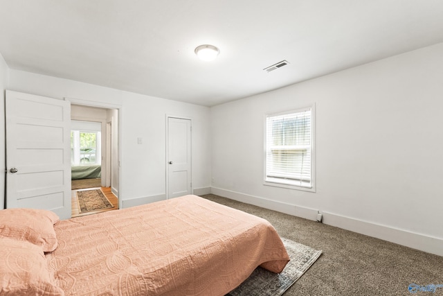 412 Oshaughnessy Ave NE, Huntsville, AL 35801 - carpeted bedroom featuring baseboards