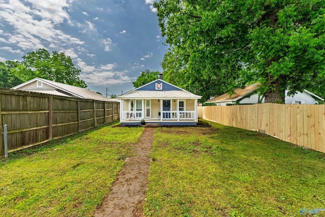 412 Oshaughnessy Ave NE, Huntsville, AL 35801 - back of house featuring covered porch and a chimney
