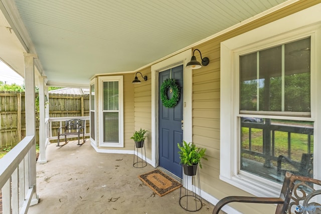 412 Oshaughnessy Ave NE, Huntsville, AL 35801 - view of exterior entry with a porch and fence