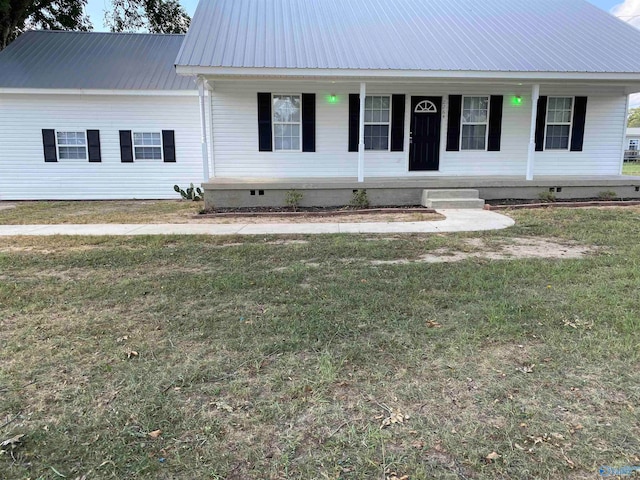 view of front facade featuring covered porch and a front yard