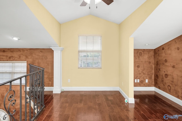 bonus room featuring dark hardwood / wood-style flooring, decorative columns, ceiling fan, and lofted ceiling