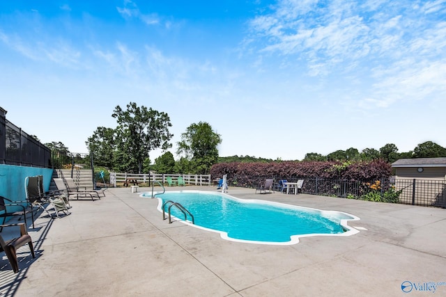 view of pool featuring a patio