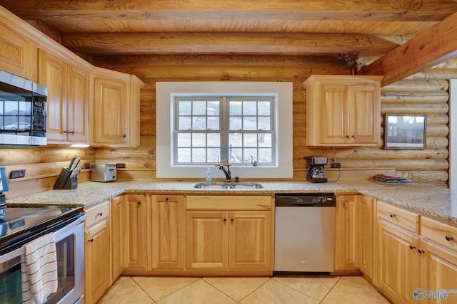 kitchen with sink, beam ceiling, light stone counters, appliances with stainless steel finishes, and log walls