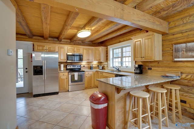 kitchen with rustic walls, appliances with stainless steel finishes, wooden ceiling, beamed ceiling, and light brown cabinets