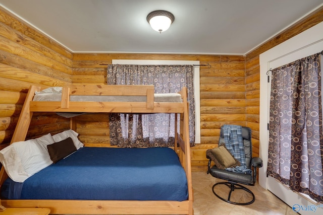 bedroom featuring log walls