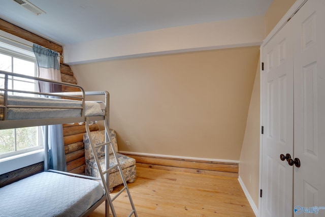 bedroom with hardwood / wood-style floors