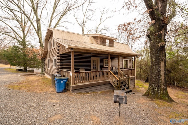 log home with covered porch