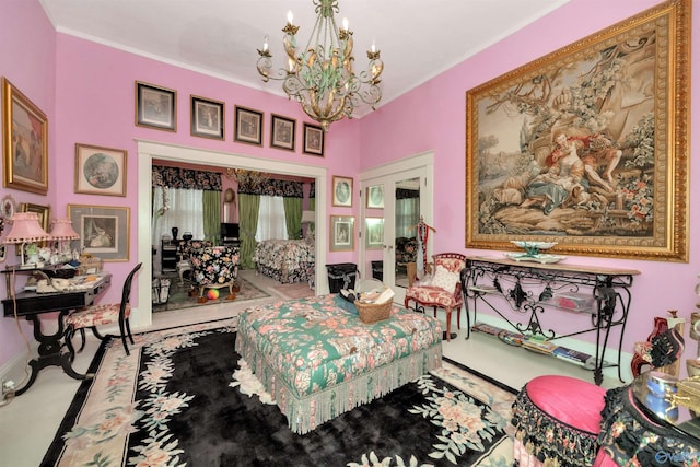 living area featuring french doors and a notable chandelier