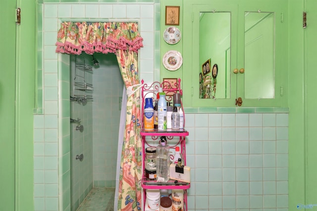 bathroom with tiled shower